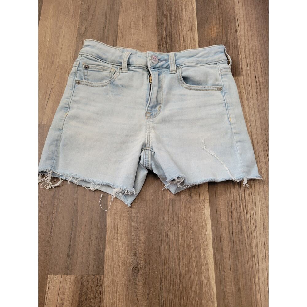 American Eagle light wash denim shorts  raw hem Size 4